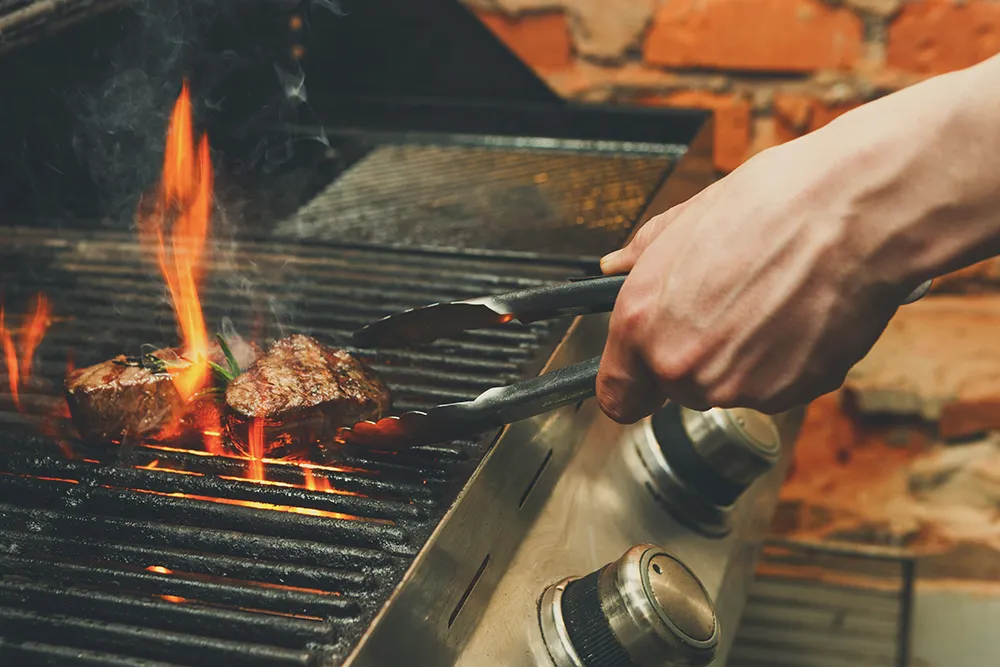  grilling steak on bbq